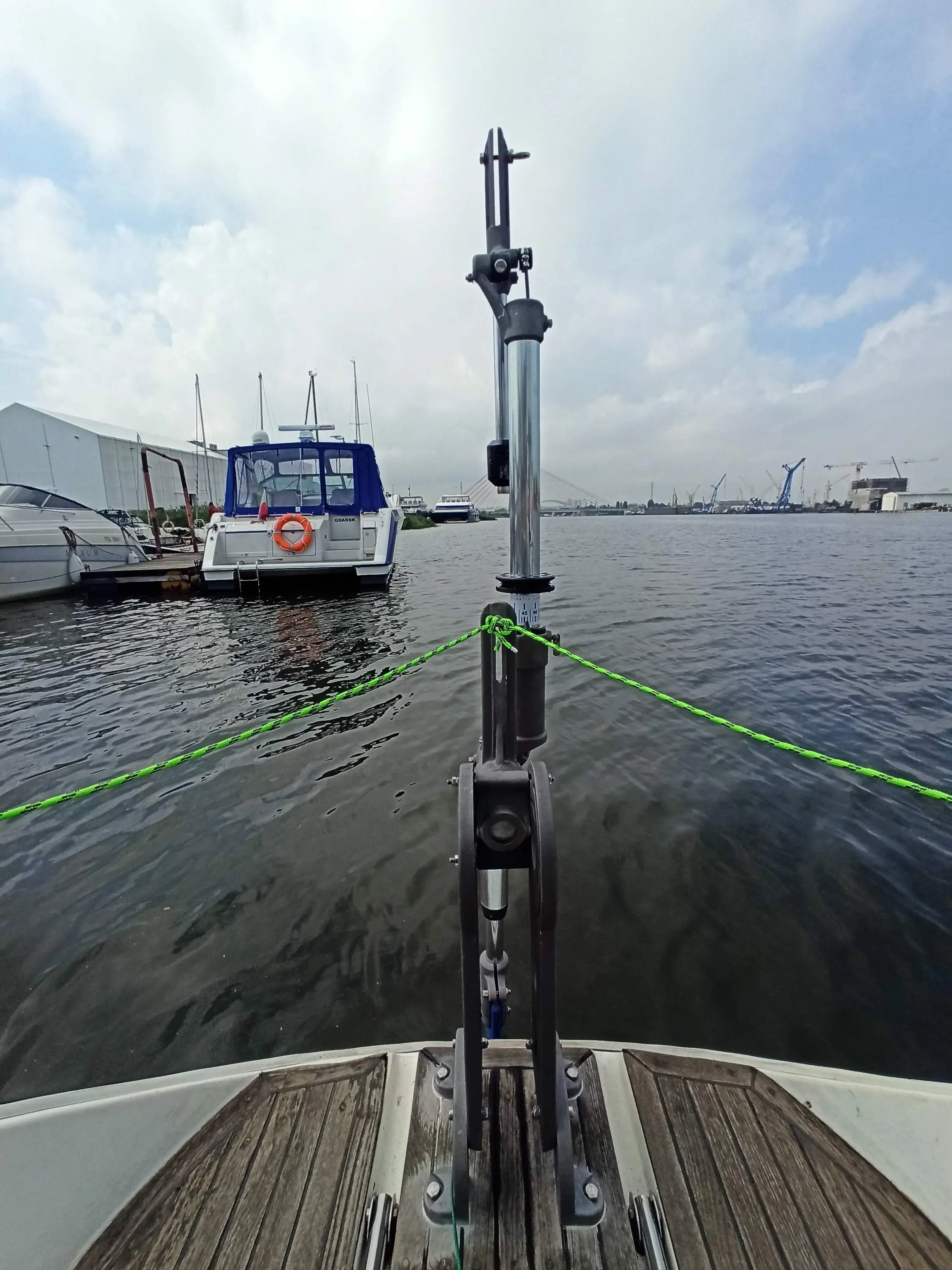 High-leverage steering lines attached to the helm of a heavy displacement vessel