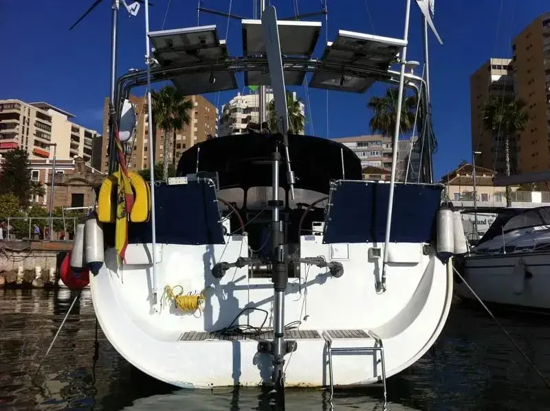 Close up of an auxiliary rudder blade submersion in water