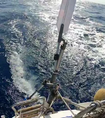 Auxiliary rudder on a sailboat  visible on the transom steering a Gulfstar 44